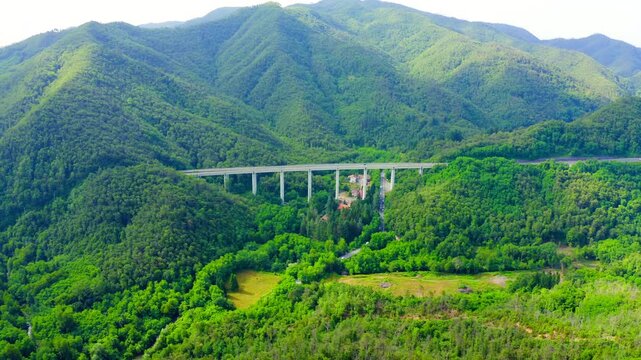 Italy, Province of La Spezia, A12. European route E80 (Trans-European Motorway or TEM). Mountain section with bridges and tunnels. Drone footage