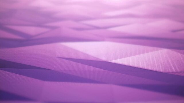 Abstract purple low poly background with geometric shapes and subtle textures moves gracefully in a seamless loop for dynamic presentation video footage use.