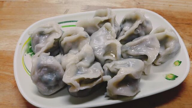 Freshly cooked dumplings arranged on a plate
