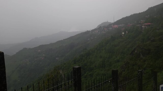 Giddha Pahar View Point in Kurseong, West Bengal, India, Scenic Himalayan Mountain Landscape Covered with Mist and Clouds, Green Hills, Foggy Weather, Mountain Tourism and Travel Background