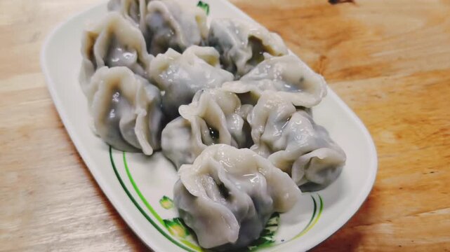 Freshly cooked dumplings arranged on a plate
