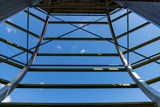 Binz, Ruegen, Mecklenburg-Western Pomerania, Germany-July 23, 2026: Symmetrical view beneath the treetop observation tower.