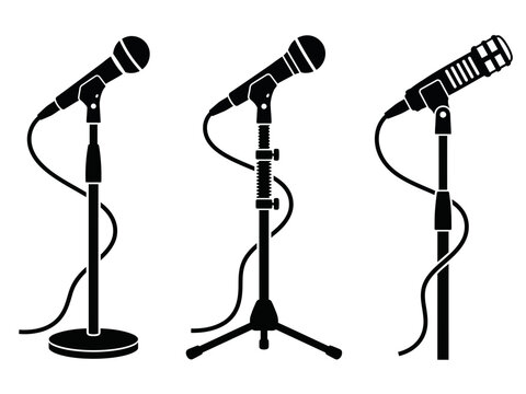 Set of three black microphones on stands for stage performance