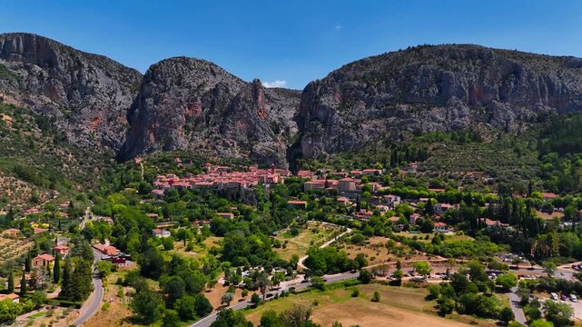Aerial drone view Village de Moustiers-Sainte-Marie among the mountains. Provence-Alpes-Cote d'Azur region. High quality 4k footage. 
