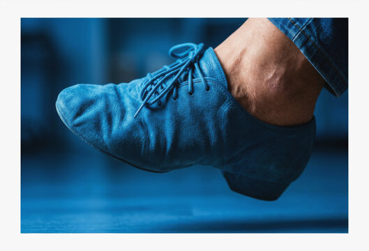 Blue suede dance shoe on a dancer's foot