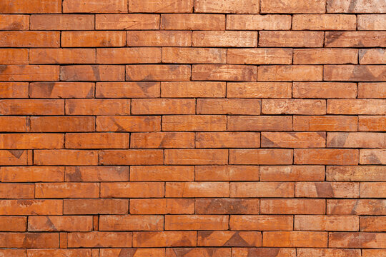 Ancient Dry Stacked Red Brick Wall Texture Background for Rustic Architecture
