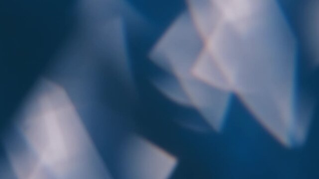 Blur glisten gleam. Flicker light. Defocused blue white color flare radiant art glare illuminated flash on abstract optical luminous background.