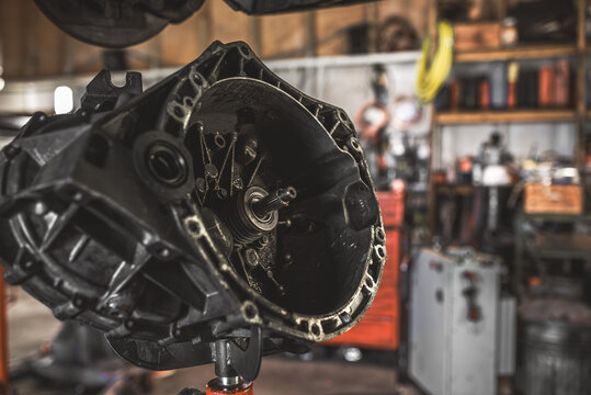 Automotive transmission housing undergoing repair in a workshop setting