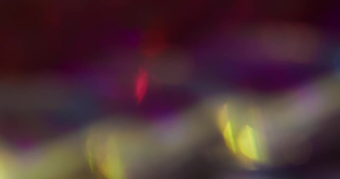 Blur shimmer flare. Flicker glow. Blue green purple color radiant illuminated rainbow flash on abstract optical art bokeh background.
