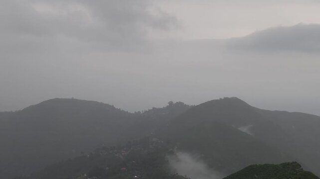 Giddha Pahar View Point in Kurseong, West Bengal, India, Scenic Himalayan Mountain Landscape Covered with Mist and Clouds, Green Hills, Foggy Weather, Mountain Tourism and Travel Background