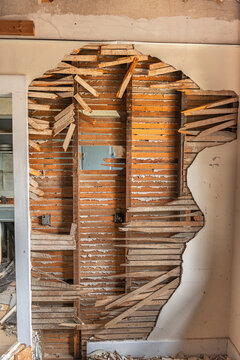 A damaged wall in an abandoned home
