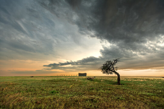 Home on the prairie at sunset
