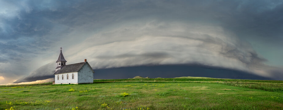Old, abandoned church out on the great plains in a storm