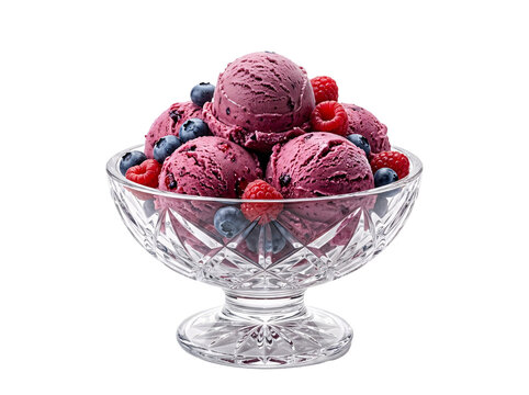 Delicious berry ice cream scoops with fresh raspberries and blueberries served in a crystal glass bowl on a black background
