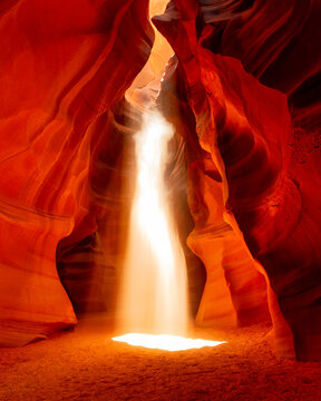 Ethereal Woman in Sunbeam within Sandstone Canyon Antelope, Arizona