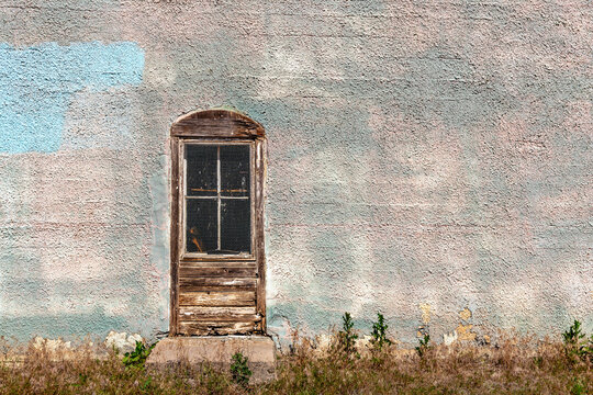 Old wooden door on side of building