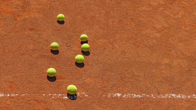  A yellow tennis balls lies on the clay court. Sport banner with copy sapce.