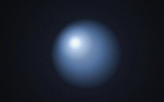 Soft glowing blue sphere on dark background abstract