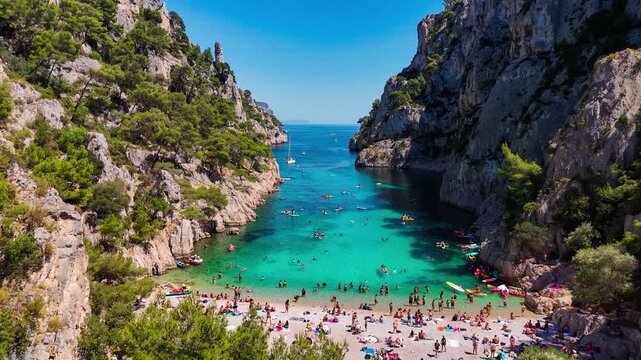 Aerial drone view of the calanques, also known as French fjords, winding bays with turquoise water among high cliffs. Provence, Alps, Cote dAzur, Marseille district, France. High quality 4k footage