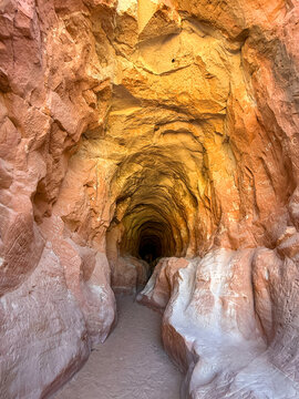 Wide angle view of the entrance to the hiking trail through the Belly of the Dragon, which is a man-made drainage tunnel with sandstone rock smoothed by water.