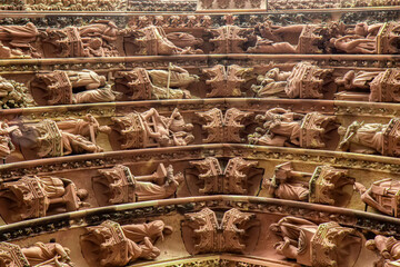 Fototapeta premium Detailed view of the richly sculpted archivolts and religious figures surrounding the Last Judgment portal on the western facade of Strasbourg Cathedral in Strasbourg, France.