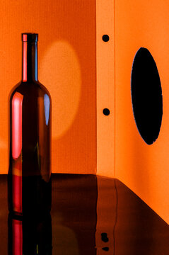 Empty brown glass bottle on an abstract background