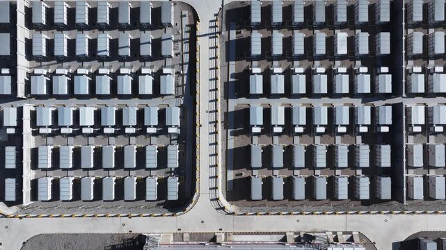 Aerial view of neatly parked trucks in a large logistics park with organized rows and industrial infrastructure