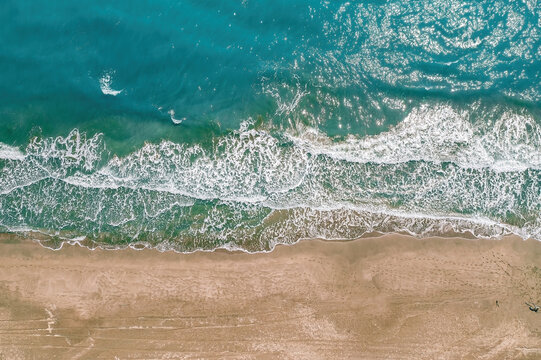 Patara, Kas. Top down aerial view of turquoise waves crashing on the sandy coastline of Patara beach.  Antalya, Turkey.