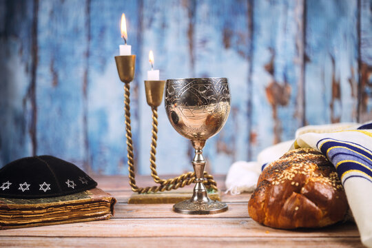 Celebration of Shabbat with traditional items on wooden table
