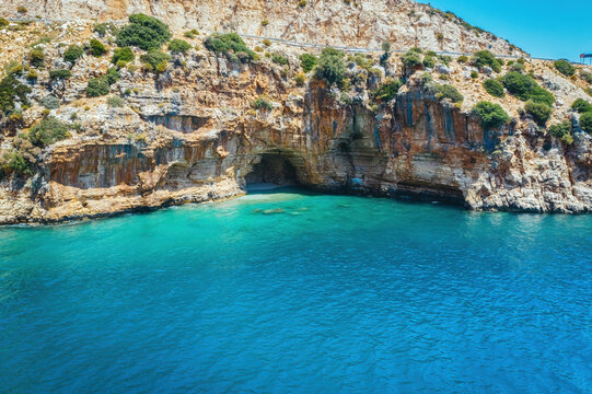 Amazing turquoise beach and cove on the way to Demre - Finike. Detail of cave. Kas, Antalya, Turkey.