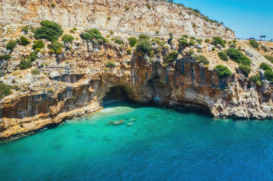 Amazing turquoise beach and cove on the way to Demre - Finike. Detail of cave. Kas, Antalya, Turkey.