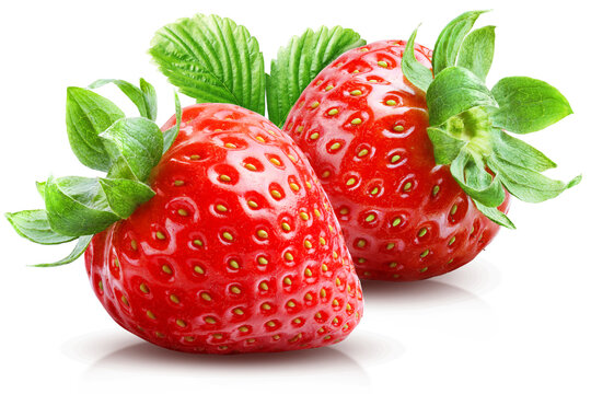 Two whole strawberries overlapping each other with leafy green tops isolated on transparent background.