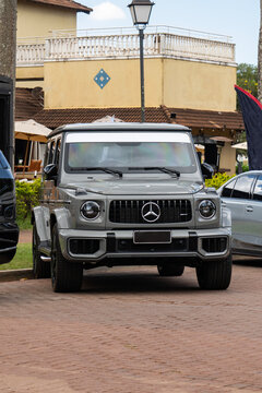 Grey Mercedes Benz G Class front view, Luxury high performance SUV parked on brick pavement