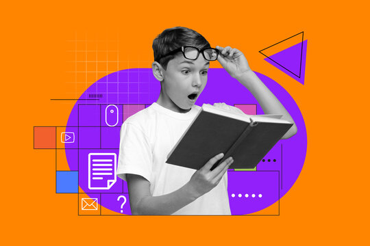 Surprised Young Caucasian Boy Wearing Glasses Reading A Book, His Eyes Wide With Wonder, Sitting At Desk In Study Room. Focused On New Knowledge, Excited About Learning Concepts.