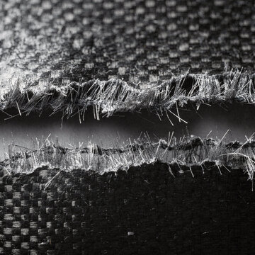 Torn Carbon Fibre Weave Macro With Splayed Filaments