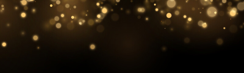 Golden stars and glowing particles in darkness. Elegant bokeh effect creates luxury appearance. Holiday abstract background illustration. © Extrastock