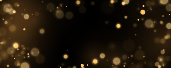Elegant gold sparkles on black backdrop. Shining particles form a luxury abstract pattern. Decorative background for creative artwork. © Extrastock