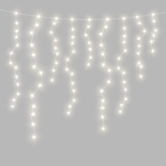 PNG Christmas bulbs glowing along a thin decorative wire. Warm golden light adds a magical holiday feeling. Great for invitations and festive banners. © Extrastock