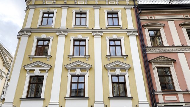 View of historic city architecture feature traditional residential building. Facades display classic design elements, detailed windows and textured walls, capturing cultural heritage urban environment