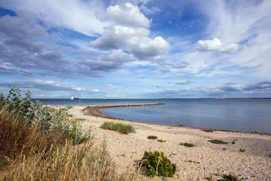 Tranquil cove with stone pier by the Baltic sea cost 