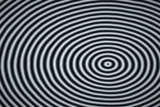 Monochromatic black and white concentric circles creating a deep visual rhythm