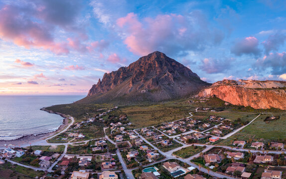 Cornino and Monte Cofano under pink sunset clouds