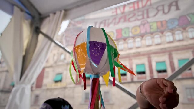 Hand Holding Traditional Mexican Pinata Colorful Paper Streamers Zocalo