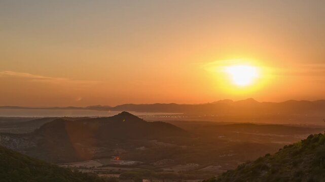 Totality of the 12 August 2026 total solar eclipse darkening the landscape, corona over hills and sea, timelapse, Mallorca, Spain

