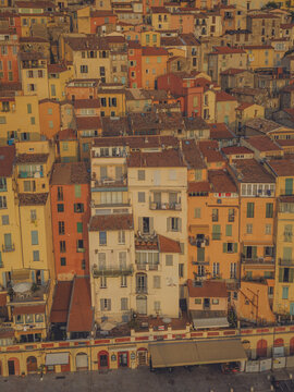 Aerial view of the colorful historic buildings and terracotta rooftops of the old town in Menton, Provence-Alpes-Cote d'Azur, France.