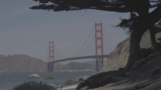 Cinematic zoom on Golden Gate Bridge from Baker Beach, San Francisco, California, USA