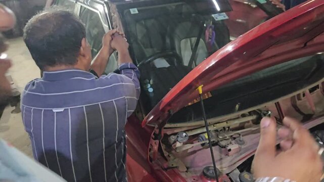 Professional Technician Removing and Installing Front Windshield Glass on Red Car in Automotive Workshop, Windshield Replacement Service, Auto Glass Repair, Vehicle Maintenance and Car Repair
