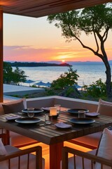 Fototapeta premium Sunset seaside outdoor dining table setting with ocean view for romantic evening background and terrace wallpaper