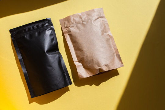 Blank craft plastic pouch, white pack on studio background with shadow, mylar bag isolated for coffee or food, cosmetic products, snack, candy. Different sizes, mock up.
