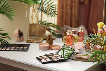Fototapeta premium Makeup products on table in dressing room, closeup